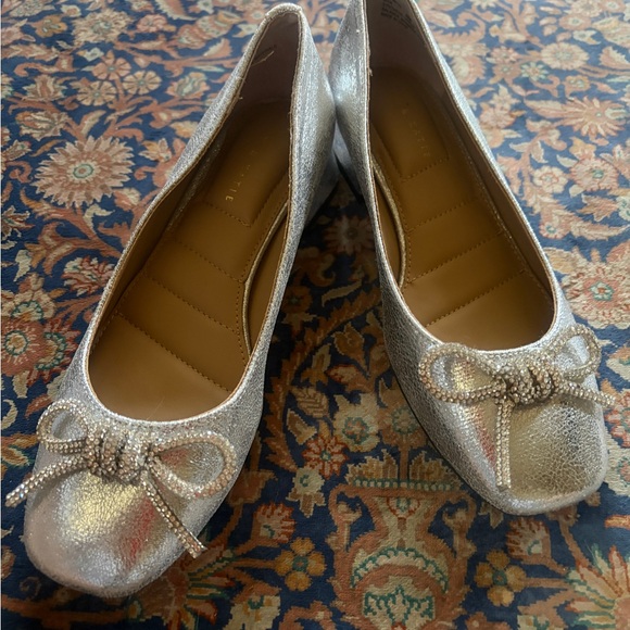 Kelly & Katie Other - Like new Kelly & Katie Shimmering Silver Flats with Bow size 6. Perfect shoe!